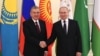 Russian leader Vladimir Putin shakes hands with Uzbek President Shavkat Mirziyoyev in St. Petersburg, Russia, during the informal meeting of the Commonwealth of Independent States, Dec. 28, 2021. (kremlin.ru) 