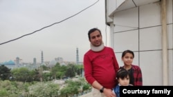 Afghan journalist Abdul Khalil Rasoli, pictured with his family in Herat, Afghanistan, before the Taliban take over. (Family handout)