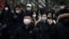 China Reports 60,000 COVID-related Deaths, Says Peak Passed