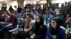 FILE - Afghan Journalists attend a press conference of a former president Hamid Karzai in Kabul, Afghanistan, Feb. 13, 2022. 