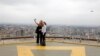 FILE - Tourists take a selfie from an observation point on the top of the Kenyatta International Convention Centre in Nairobi, Kenya, June 21, 2019. 
