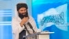 FILE - Taliban Interior Minister Sirajuddin Haqqani speaks during a ceremony marking the 30th anniversary of the victory over the government of communist regime, in Kabul on April 28, 2022. 