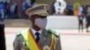 FILE - Colonel Assimi Goita, leader of two military coups, walks during the inauguration ceremony making him Mali's new interim president, in Bamako, Mali June 7, 2021.