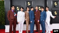 FILE - Members of the South Korean K-pop band BTS pose for a photo as they arrive for the 64th Annual Grammy Awards at the MGM Grand Garden Arena in Las Vegas, Nevada, April 03, 2022. 