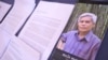 FILE - A pamphlet about Sombath Somphone sits on display at an event in Bangkok, Thailand, Dec. 15, 2022, marking the 10-year anniversary of his enforced disappearance in Laos. 