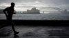 A man runs along the waterfront in Sydney, Australia, Oct. 6, 2022. 