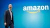 FILE - Amazon CEO Jeff Bezos walks onstage for the launch of the new Amazon Fire Phone, in Seattle, June 16, 2014.