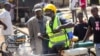 Kenyan Riot Police Use Tear Gas to Clear Crowded Market