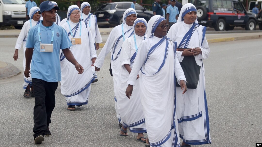 Nuns walk toward the entrance of the Port Moresby International airport on Sept. 6, 2024, prior to the arrival of Pope Francis. Over mountains, by air, and by sea, pilgrims flocked to the capital ahead of Pope Francis's arrival on Sept. 6 on a landmark four-day visit.