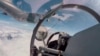 FILE - In this video screenshot released by China's Xinhua News Agency, the air force and naval aviation corps of the Eastern Theater Command of the Chinese People's Liberation Army conducts aerial refueling at an unspecified location, Aug. 4, 2022.