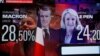 Izborni rezultati na ekranu u izbornom štabu Marin Le Pen u Parizu, 10. aprila 2022. 