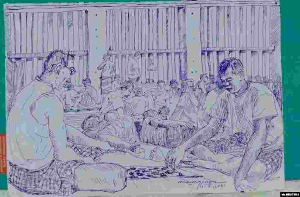MYANMAR-POLITICS/PRISON -A smuggled sketch shows people inside of Myanmar's Insein prison with a written date April 17, 2021, in this undated picture obtained by REUTERS