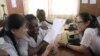 FILE - Chinese language teachers talk to a Nigerian student at the Confucius Institute at the University of Lagos, April 6, 2016. Confucius Institutes in the United States are rebranding and reopening, according to a report by the National Association of Scholars.