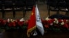 FILE - The flags of China and the Islamic Emirate of Afghanistan are displayed during a news conference held by officials of the two countries in Kabul, Jan. 5, 2023. Officials from China, Pakistan and the Afghan Taliban will hold talks starting May 5, 2023, in Islamabad.