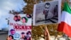 FILE - People hold portraits of Iranian rapper Toomaj Salehi, right, and children, left, who were killed during the protests in Iran, during a rally in Istanbul, on Nov. 26, 2022. 