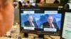 FILE - An AFP journalist watches a video manipulated with artificial intelligence to potentially deceive viewers, or "deepfake," at his desk in Washington, D.C., Jan. 25, 2019.