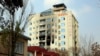 A hotel building sits charred after an attack in Kabul, Afghanistan, Dec. 13, 2022. The militant Islamic State group has claimed responsibility for a coordinated attack on the Chinese-owned hotel in the capital.