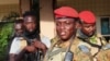 FILE - Burkina Faso's military leader Ibrahim Traore is escorted by soldiers in Ouagadougou, Oct. 2, 2022. He has faced several alleged coup attempts from within the military since he took power more than two years ago.