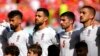 Iran's players line up for the singing of the national anthem ahead of the World Cup group B soccer match between Wales and Iran, at the Ahmad Bin Ali Stadium in Al Rayyan, Qatar, Nov. 25, 2022.