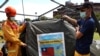 Firefighters show the Taiwanese flag on their tent at a drill on Taiwan's annual earthquake and national disaster prevention day, after an earthquake in the southeastern part of the quake-prone island, in Hualien, Taiwan, Sept. 21, 2022. 