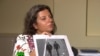 RT Editor-in-Chief Margarita Simonyan shows an image of two men during an interview with the two who are suspected by British authorities of poisoning Sergei and Yulia Skripal in Salisbury, England on March 4, 2018. 