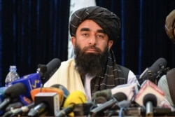 Portparol talibana Zabihulah Muđahid na prvoj konferenciji za novinare u Kabulu 17. avgusta 2021, nakon što su talibani zapanjujuće brzi zauzeli Avganistan.