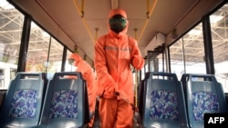 Ryonmot Trolley Bus Office health officials disinfect a bus to help prevent the spread of COVID-19 in North Korea, June 9, 2022. In order to roll out a countrywide immunization campaign, North Korea needs vaccines, cold storage, and trained medical and technical workers.