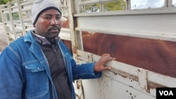 Nkayi farmer Lindani Mpofu receiving cattle donated by Matabeleland North farmers after his family lost 21 of them sometime this month
