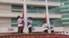 中國國慶日港警阻止社民連4人示威有五星紅旗被燒毀