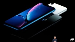 Apple CEO Tim Cook discusses the new iPhones at the Steve Jobs Theater during an event to announce new products Wednesday, Sept. 12, 2018, in Cupertino, Calif. (AP Photo/Marcio Jose Sanchez)