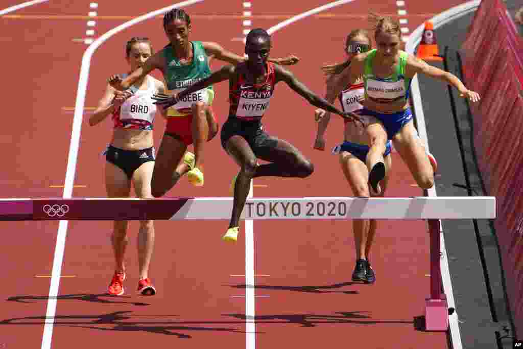 Hyvin Kiyeng, of Kenya, wins a heat of the women's 3,000-meter steeplechase at the 2020 Summer Olympics, Sunday, Aug. 1, 2021, in Tokyo. (AP Photo/Charlie Riedel)