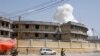 Soldiers stand on alert near an explosion near the presidential palace in the capital Mogadishu, Somalia, Dec. 22, 2018. 