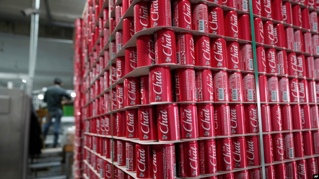 FILE - Pallets of branded aluminum cans at the production line in the Palestinian Chat Cola bottling plant, in the West Bank city of Salfit, Feb. 13, 2025. 