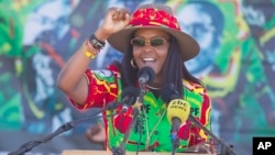 FILE - Zimbabwe's First Lady Grace Mugabe greets supporters at a rally in Lupane about 170 Kilometres north of Bulawayo, Zimbabwe, July 21, 2017. 