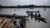 FILE - Central African refugees arrive in Ndu after crossing the Mbomou River, which marks the border between the Central African Republic and the Democratic Republic of Congo, Feb. 5, 2021. 
