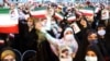 Supporters of Iranian president-elect Ebrahim Raisi celebrate after he won the presidential election in Tehran, Iran, June 19, 2021.