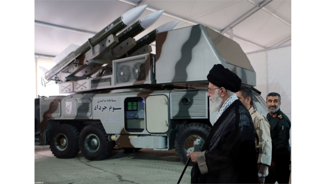 Iran's Supreme Leader Ayatollah Ali Khamenei is seen near a "3 Khordad" system which is said to had been used to shoot down a U.S. military drone.