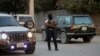 FILE - A police officer patrols a street in Port-au-Prince, Haiti, Dec. 11, 2024. Security units worked Feb. 8, 2025, to disrupt activities organized by the 400 Mawozo gang. 