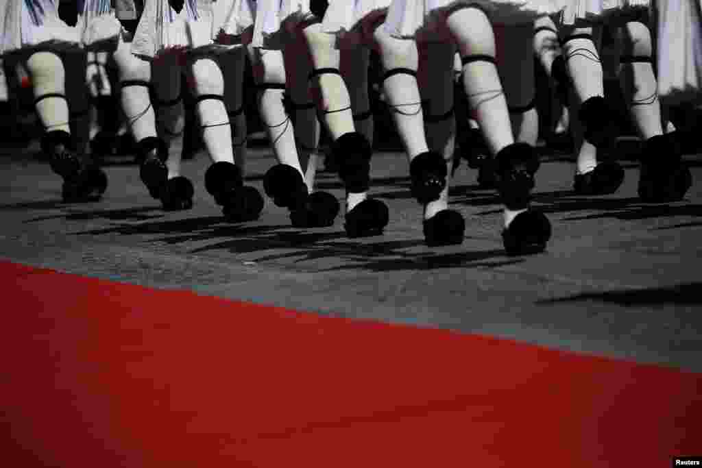 Greek Presidential Guards perform during a welcoming ceremony for French President Emmanuel Macron in Athens.