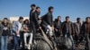 In Damascus, students and schoolchildren resume classes without Assad