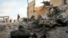 FILE - Somali soldier on site of car bomb attack in the capital, Mogadishu, June 21, 2015.