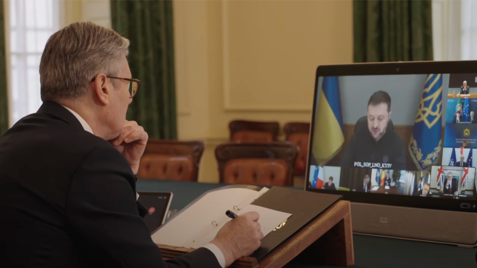 In this photo taken from video on March 15, 2025, British Prime Minister Keir Starmer participates from London in a virtual meeting with a group of European, Australian, New Zealand and Canadian leaders. They discussed the proposed ceasefire between Russia and Ukraine.