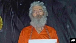 Undated handout photo shows retired FBI agent Robert Levinson. His family received these photographs in April 2011.
