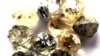 FILE - In this undated photo, rough diamonds are displayed at the Botswana Diamond Valuing Company in Gaborone.