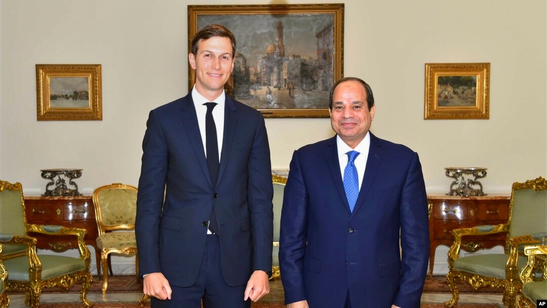In this photo provided by Egypt's state news agency, MENA, Egypt's President Abdel-Fattah el-Sissi, right, poses for a photo with White House adviser Jared Kushner, in Cairo, Egypt, Wednesday, Aug. 23, 2017. 