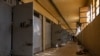 A Syrian man inspects cells at the prison of Saydnaya, north of Damascus, Dec. 16, 2024.