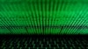 FILE - A computer keyboard lit by a displayed cyber code is seen in this illustration picture. In a few short years, scamming hubs bilking billions of dollars out of victims across the globe have set up shop in Cambodia, Laos, the Philippines and, increasingly, Myanmar.