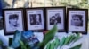 FILE - Photos of Koos Koster, Jan Kuiper, Joop Willemsen and Hans ter Laag, who were killed in 1982, are seen during the inauguration ceremony of the memorial built in their memory, in Santa Rita, El Salvador, Oct. 24, 2024. 