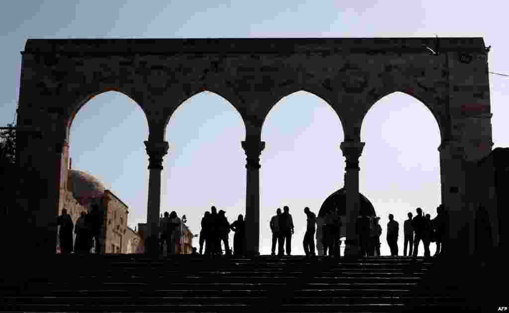Palestinians are blocked on one side of the the flashpoint Al-Aqsa mosque compound, also known as the Temple Mount complex in Jerusalem's Old City during the visit of a controversial Jewish parliament member.