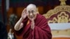 FILE- Tibetan spiritual leader the Dalai Lama greets devotees at the Buddha Park in Bomdila, Arunachal Pradesh, India, April 5, 2017. 